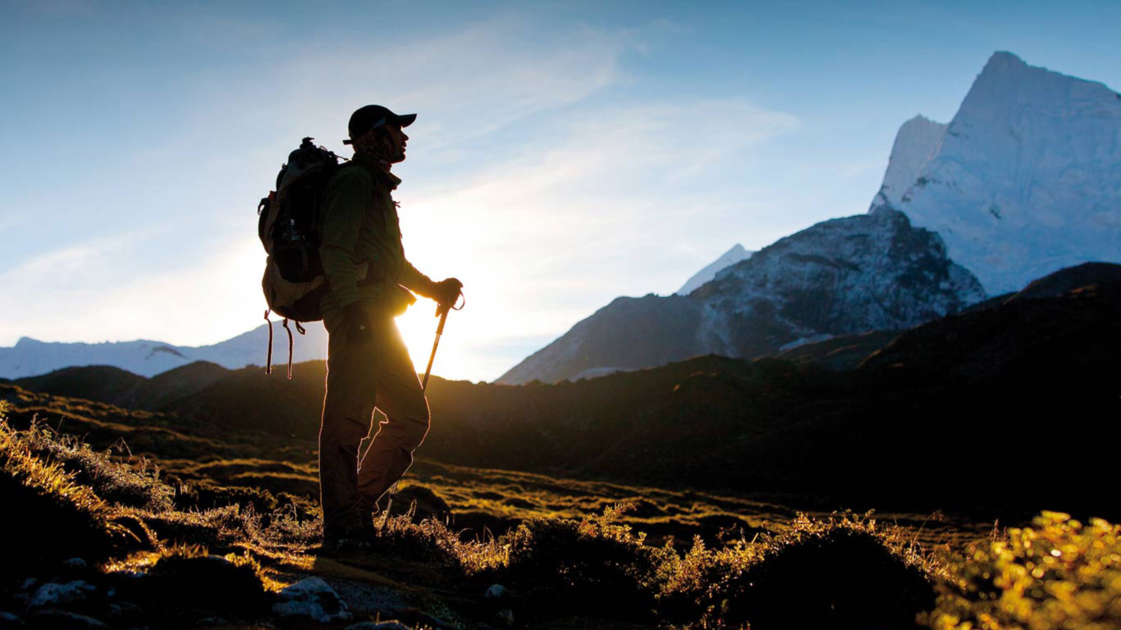 A trekker taking in a Himalayan mountain view